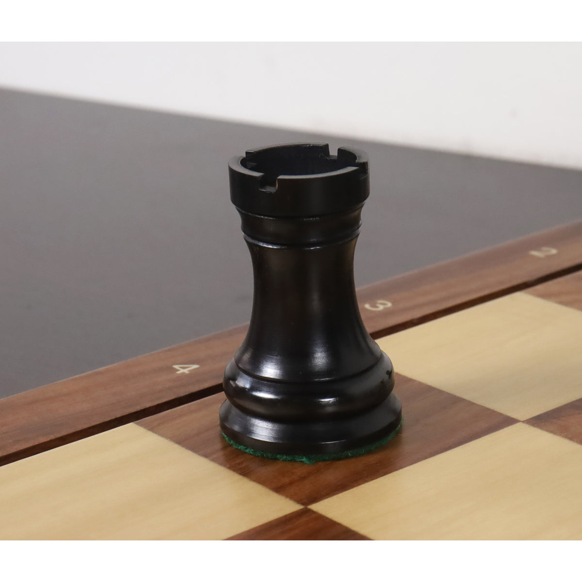 Ebonised boxwood rook with a sturdy base and clean crenellations from the Soviet chess set.