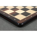 Side profile of a flat rosewood chessboard featuring smooth rounded corners and edges.