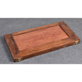 Fully folded golden rosewood chess board highlighting its compact and portable design for travel.