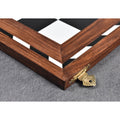Close-up of the elegant brass clasp and natural wood grain on a golden rosewood folding chess board.