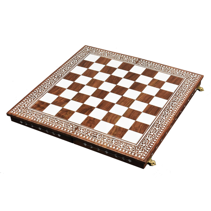 Angled view of an open 15 inch golden rosewood chess board with faux ivory inlaid playing surface.
