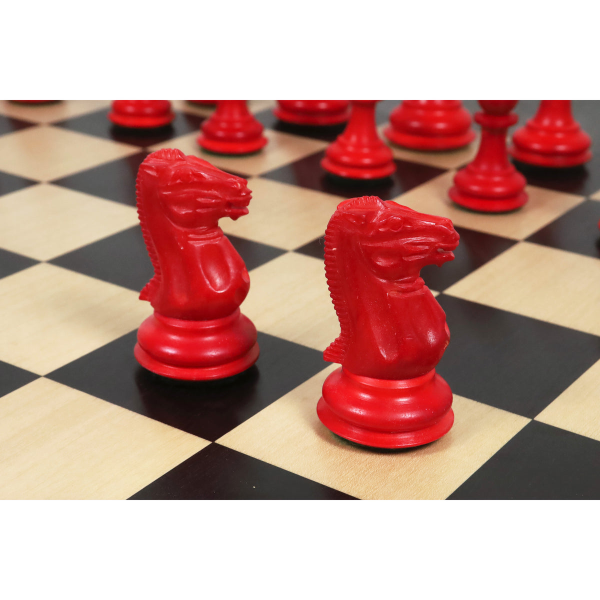 Pair of hand-carved crimson camel bone knights from the 1849 Jacques Cook luxury chess set.