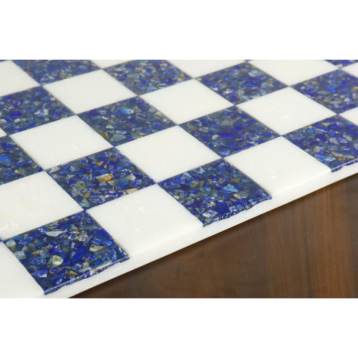 Detailed texture of natural blue lapis lazuli and white marble squares on a premium chess board.