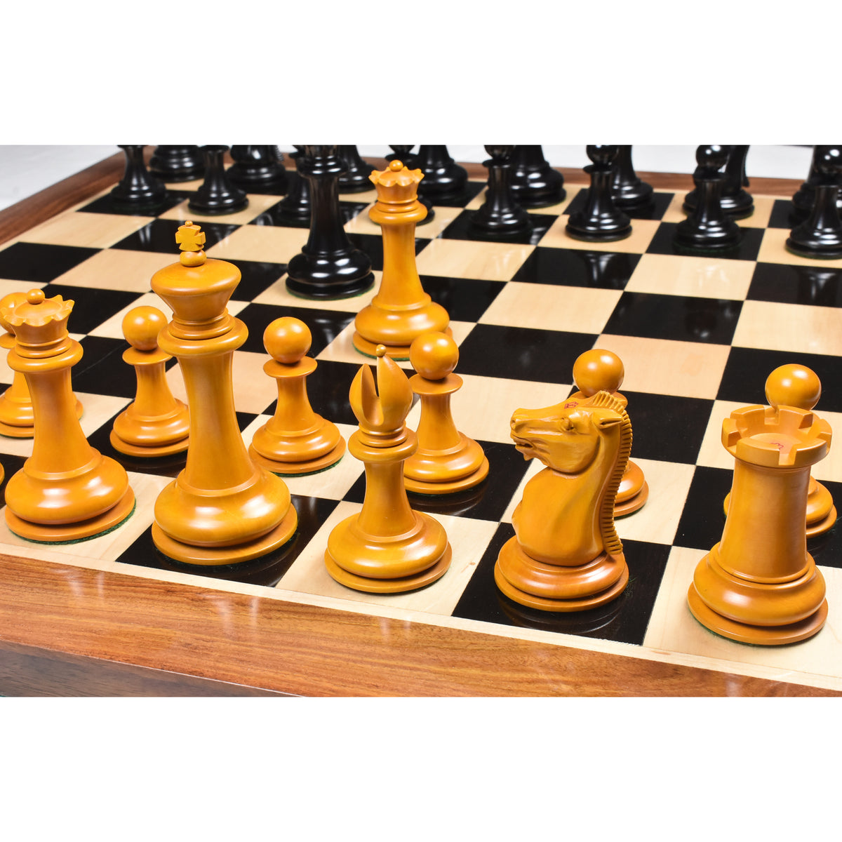 Antiqued boxwood King, Queen, and Knight from the 4.5 inch Leuchars Cook Staunton chess set.