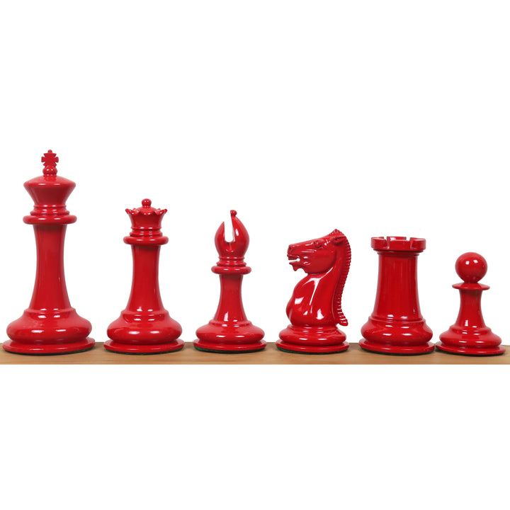 High-gloss crimson red lacquer Leuchars Cook Staunton chess pieces in a rank lineup.