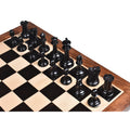 Top-down view of the ebony wood chess pieces arranged for play on a premium wooden board.