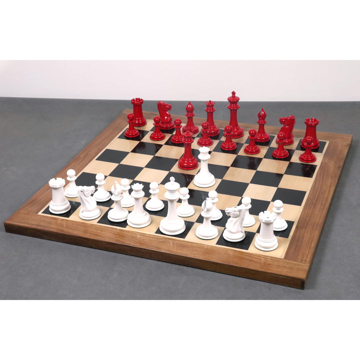 Ivory and crimson Leuchars Cook Staunton chess pieces set up on a luxury wooden board.