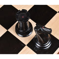Ebony Rook and Knight showing the distinctive red crown stamps on the flat head surfaces.