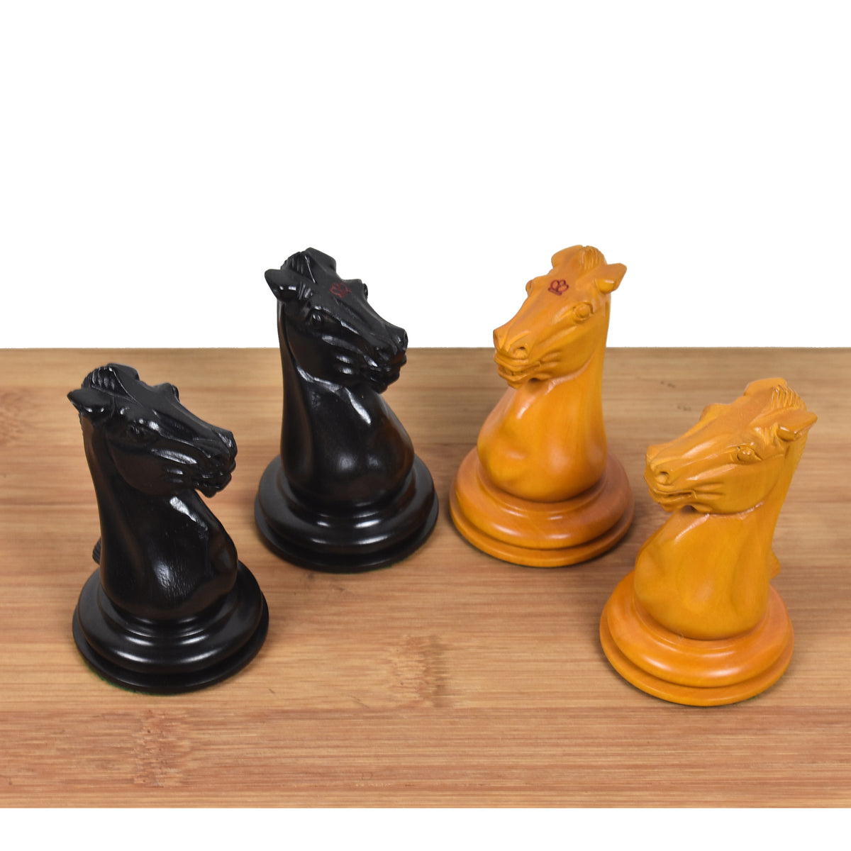 Detailed top view of Leuchars Cook Staunton knights in ebony and antiqued boxwood finishes.