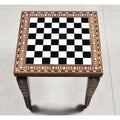 Overhead view of a 14 inch golden rosewood chess board with ivory acrylic floral border inlay.