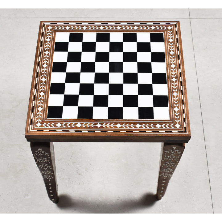 Overhead view of a 14 inch golden rosewood chess board with ivory acrylic floral border inlay.