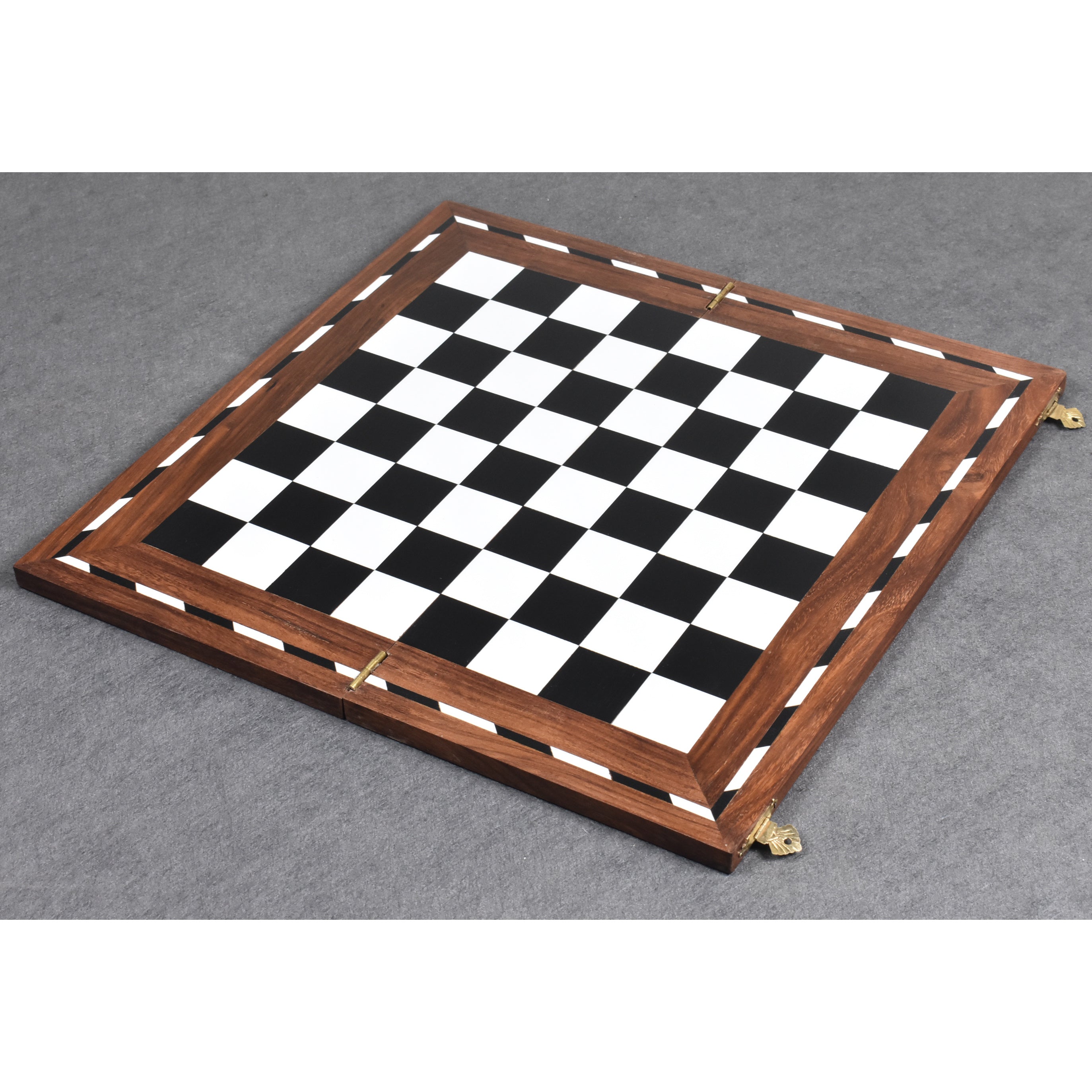 Flat lay of a 14 inch golden rosewood and acrylic ivory folding chess board with black and white squares.