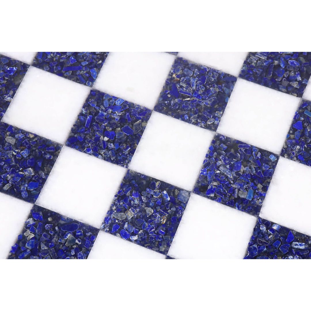 Macro shot of the blue stone and white marble checkered pattern on a luxury chess board.