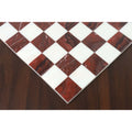 Corner detail of a borderless marble chess board highlighting the seamless semi-precious stone inlay.