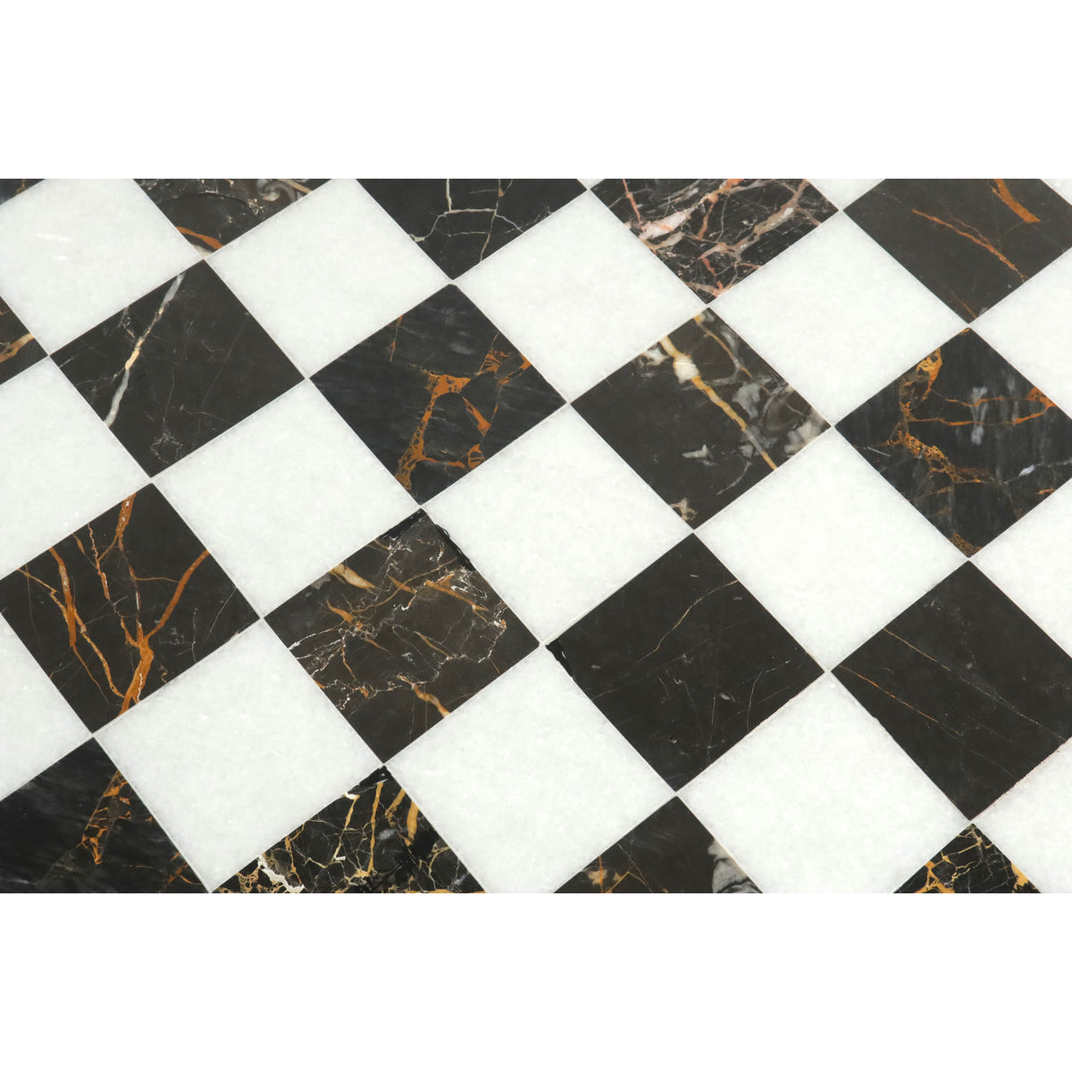 Detailed close-up of natural veining on a black and white marble stone luxury chess board.