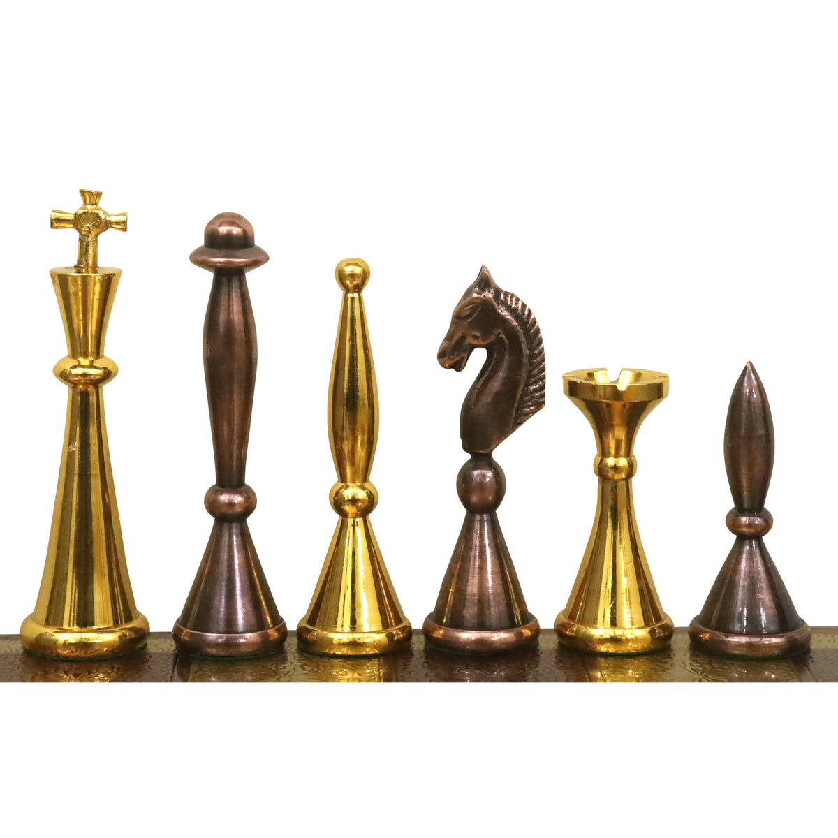 Complete lineup of modern luxury brass chess pieces showing the unique tall, slender silhouette.