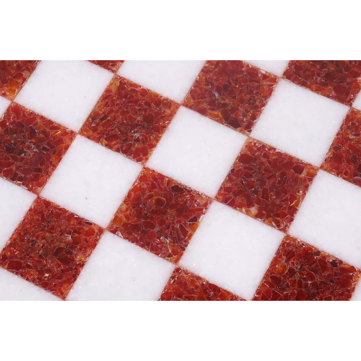 Macro view of the intricate red stone patterns in a handcrafted marble chess board.