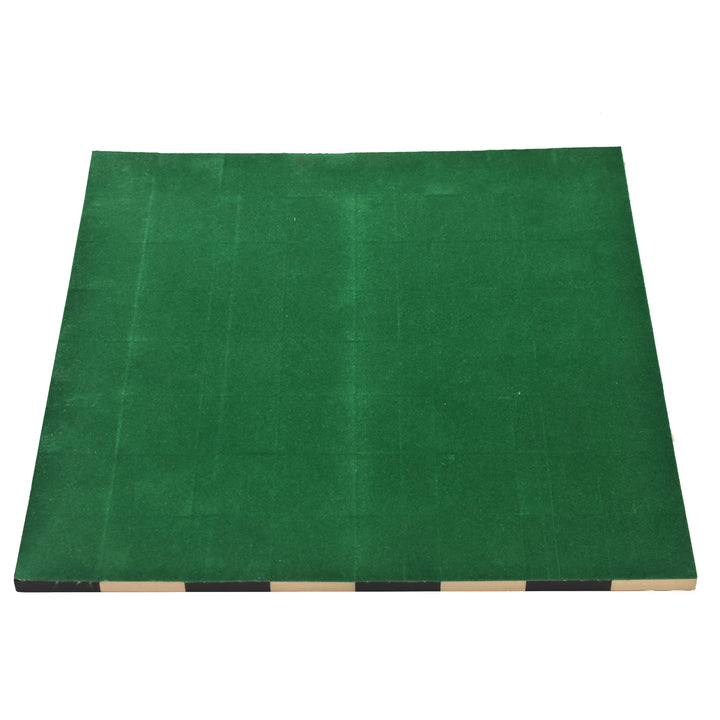 Bottom view of the roll up travel chess board showing the protective green felt backing for scratch-free play.