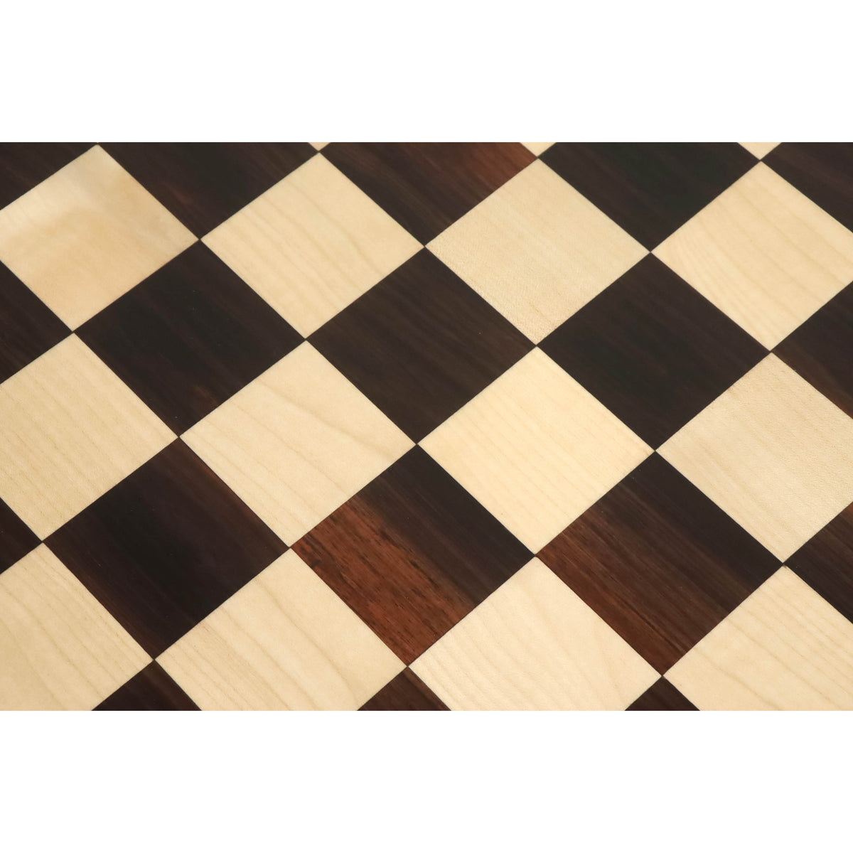 High-resolution detail of alternating rosewood and maple wood chess squares.