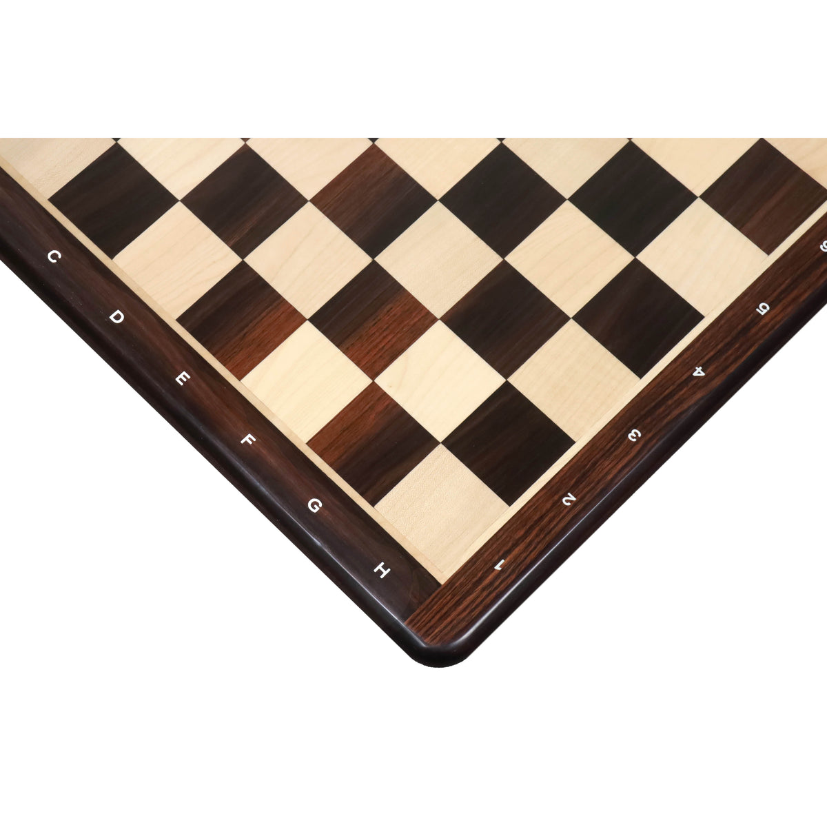 Close-up of a rosewood and maple chessboard corner with white algebraic notations.
