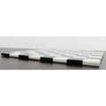 Side profile showing the sleek thickness of a solid black and white marble stone chess board.