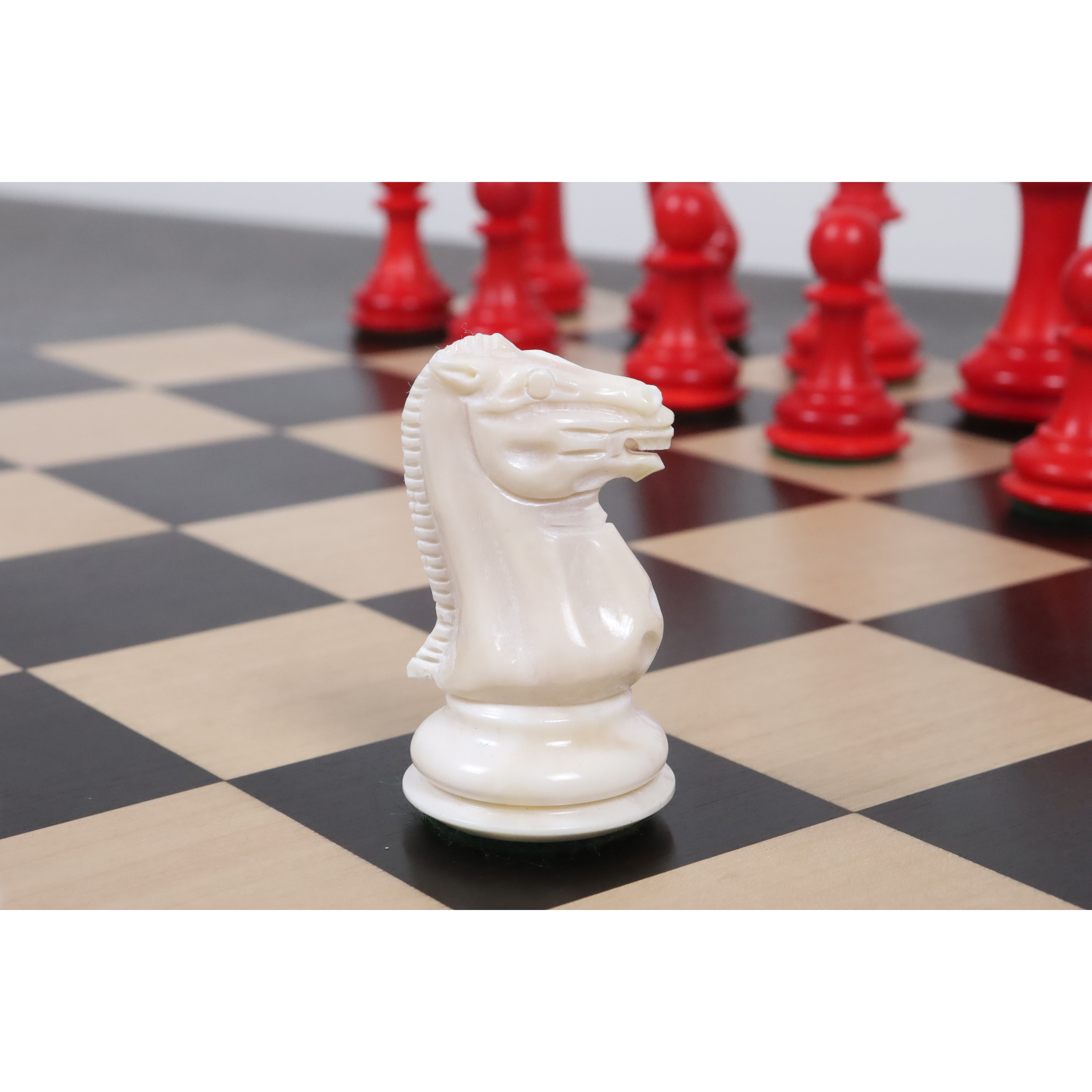 Profile of a white camel bone knight piece showing exquisite hand-carved details and craftsmanship.