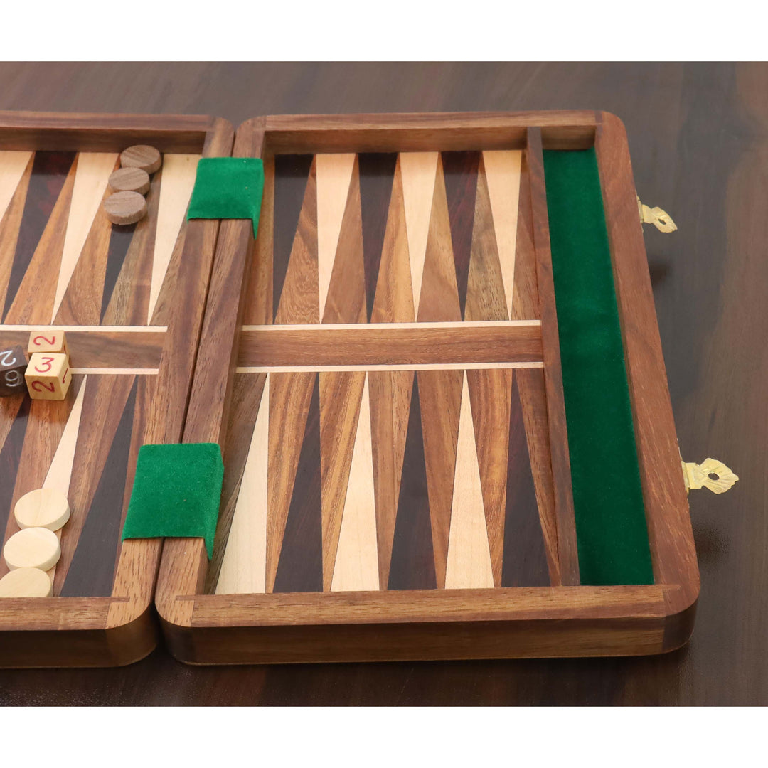 Close-up of inlaid wood triangles and green felt lining on a handcrafted travel backgammon board.