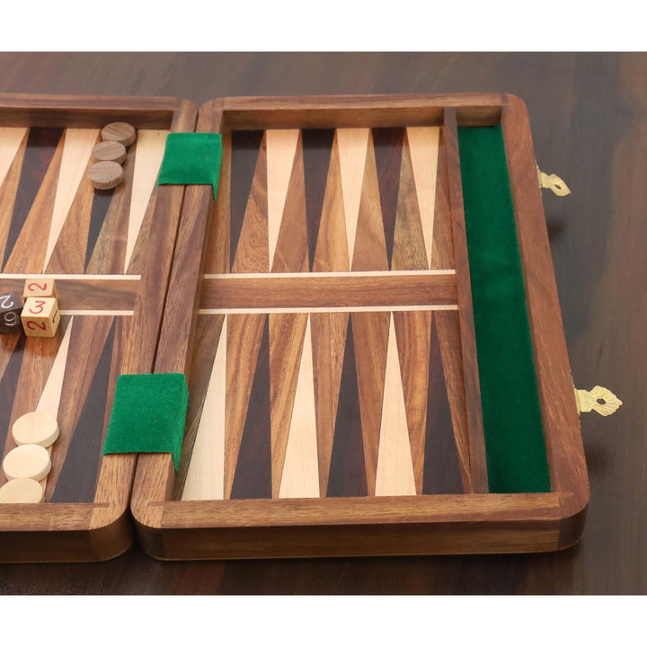 Close-up of inlaid wood triangles and green felt lining on a handcrafted travel backgammon board.